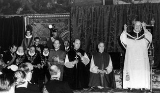 Pope John XXIII stands and prays in the Sistine Chapel in Vatican City, on Oct. 12, 1962, during a special audience for delegates from foreign governments to the ecumenical council. Pope Francis commemorates the 60th anniversary of the opening of the Second Vatican Council by celebrating a Mass in honor of St. John XXIII, the “good pope” who convened the landmark meetings that modernized the Catholic Church. (AP Photo/File)