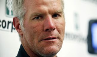 Former NFL quarterback Brett Favre speaks with reporters prior to his induction to the Mississippi Hall of Fame in Jackson, Miss., Saturday, Aug. 1, 2015. Mississippi&#39;s largest public corruption case in state history, in which tens of millions of dollars earmarked for needy families was misspent, involves a number of sports figures with ties to the state — including NFL royalty Brett Favre and a famous former pro wrestler. (AP Photo/Rogelio V. Solis, File)
