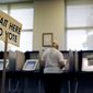 A sign greets voters before they step up to cast their ballot at a polling site, Tuesday, July 22, 2014, in Atlanta, Georgia. (AP Photo)