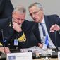 NATO Secretary-General Jens Stoltenberg, right, talks to Chair of the NATO Military Committee, Admiral Rob Bauer during a meeting of NATO defense ministers in the Ukraine Defense Contact Group format at NATO headquarters in Brussels, Wednesday, Oct. 12, 2022. (AP Photo/Olivier Matthys)