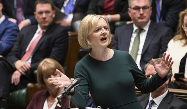 In this handout photo provided by UK Parliament, Britain&#x27;s Prime Minister Liz Truss speaks during Prime Minister&#x27;s Questions in the House of Commons in London, Wednesday, Oct. 12, 2022. (Jessica Taylor/UK Parliament via AP)