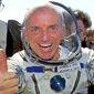 U.S. multimillionaire Dennis Tito gives a thumbs-up shortly after his landing in the Central Asian steppes, 80 kilometers (50 miles) northeast of Arkalyk, Kazakstan on May 6, 2001. The world’s first space tourist has signed up to spin around the moon aboard Elon Musk’s Starship. For Dennis Tito, it’s a chance to relive the joy of his trip 21 years ago to the International Space Station. (AP Photo/Mikhail Metzel, File)