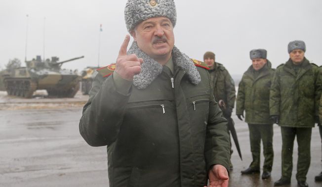 FILE - Belarusian President Alexander Lukashenko gestures while speaking to journalists at the Osipovichi training ground during the Union Courage-2022 Russia-Belarus military drills near Osipovichi , Belarus, Thursday, Feb. 17, 2022. Lukashenko this week once again accused Ukraine of planning to attack it and announced creating a joint grouping of troops with Moscow, a move that stocked fears that Belarusian army could join Russian forces in Ukrainian trenches. (AP Photo, File)