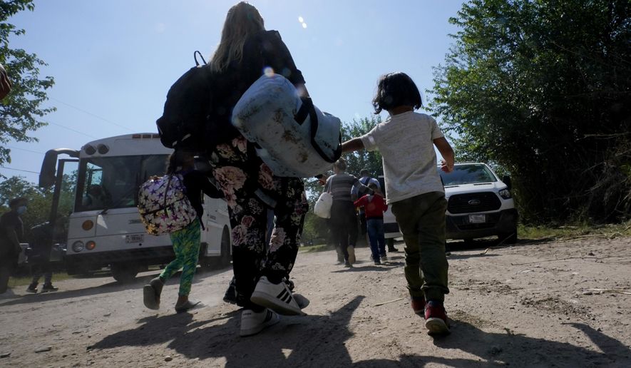 A migrant family from Venezuela walks to a Border Patrol transport vehicle after they and other migrants crossed the U.S.-Mexico border and turned themselves in June 16, 2021, in Del Rio, Texas. The Biden administration has agreed to accept up to 24,000 Venezuelan migrants, similar to how Ukrainians have been admitted after Russia’s invasion, while Mexico has agreed to accept some Venezuelans who are expelled from the United States, the two nations said Wednesday, Oct. 12, 2022. (AP Photo/Eric Gay, File)