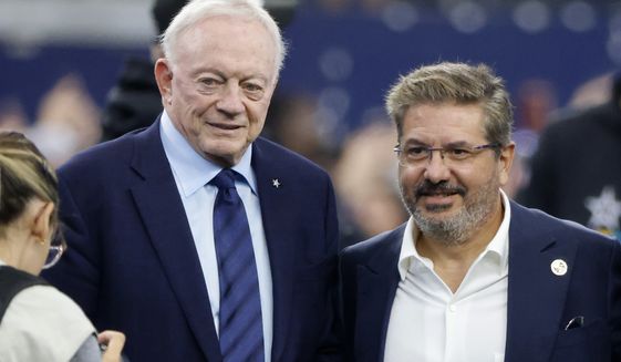 FILE - Dallas Cowboys team owner Jerry Jones and Dan Snyder, co-owner and co-CEO of the Washington Commanders, pose for a photo on the field during warmups before a NFL football game in Arlington, Texas, Sunday, Oct. 2, 2022. The Washington Commanders are denying the contents of a report by ESPN detailing Dan Snyder&#39;s efforts to influence other NFL owners and the league office to keep control of the team. In a statement sent to The Associated Press on Thursday, Oct. 13, a Commanders spokesperson called it “categorically untrue” and “clearly part of a well-funded, two-year campaign to coerce the sale of the team, which will continue to be unsuccessful.”(AP Photo/Michael Ainsworth, File)