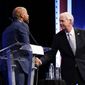 Republican U.S. Senate candidate Ron Johnson, right, and Democratic U.S. Senate candidate Mandela Barnes, left, shake hands during a televised debate Thursday, Oct. 13, 2022, in Milwaukee. (AP Photo/Morry Gash)