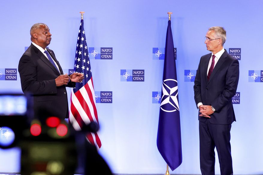NATO Secretary General Jens-Stoltenberg, right, and U.S. Secretary for Defense Lloyd J. Austin III participate in a media conference during a meeting of NATO defense ministers at NATO headquarters in Brussels, Thursday, Oct. 13, 2022. NATO defense ministers meet in Brussels Thursday, aiming to help bolster Ukraine&#x27;s aerial defenses, after a widespread Russian assault across the country early this week. (AP Photo/Olivier Matthys)