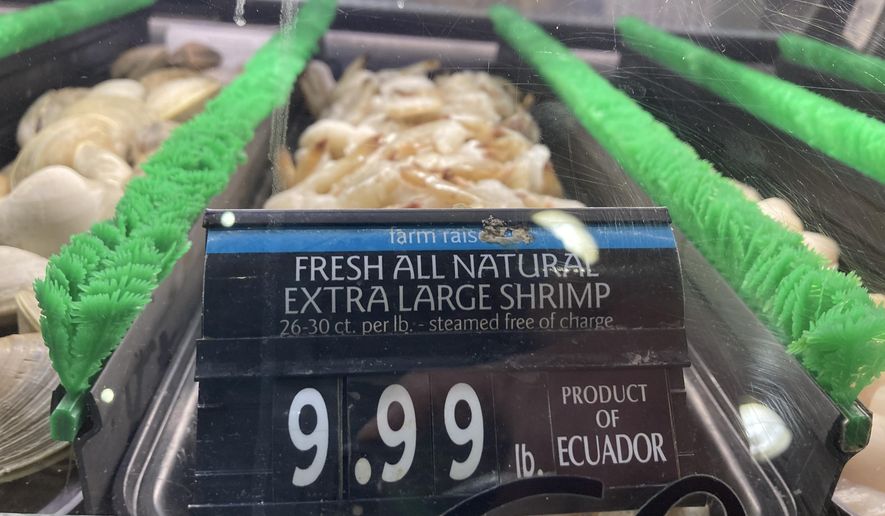 The price of shrimp is displayed at a market in Philadelphia, Thursday, June 16, 2022. (AP Photo/Matt Rourke, File)