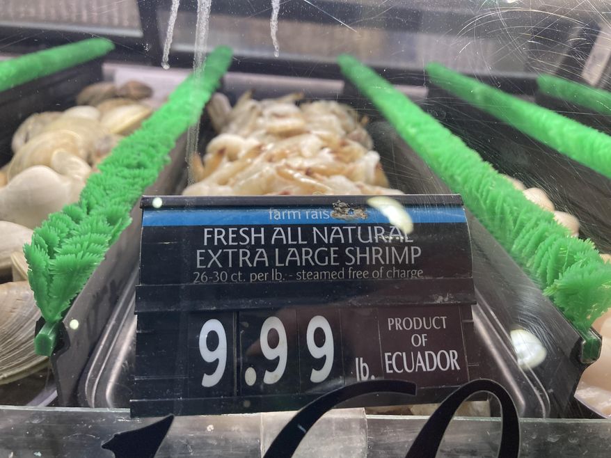 The price of shrimp is displayed at a market in Philadelphia, Thursday, June 16, 2022. (AP Photo/Matt Rourke, File)