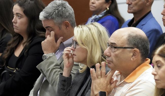 From left; Abby Hoyer, Tom and Gena Hoyer, and Michael Schulman react during the reading of jury instructions in the penalty phase of the trial of Marjory Stoneman Douglas High School shooter Nikolas Cruz at the Broward County Courthouse in Fort Lauderdale, Fla. on Wednesday, Oct. 12, 2022. The Hoyer&#x27;s son, Luke, and Schulman&#x27;s son, Scott Beigel, were killed in the 2018 shootings. Abby Hoyer is Luke Hoyer&#x27;s sister. Cruz previously plead guilty to all 17 counts of premeditated murder and 17 counts of attempted murder in the 2018 shootings. (Amy Beth Bennett/South Florida Sun Sentinel via AP, Pool)