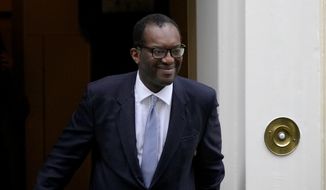 Britain&#x27;s former Chancellor of the Exchequer Kwasi Kwarteng leaves 11 Downing Street after being sacked by the Prime Minister Liz Truss in London, Friday, Oct. 14, 2022. Kwarteng has left the government, ahead of an announcement by Prime Minister Liz Truss on changes to an economic package that sparked market turmoil. (AP Photo/Kirsty Wigglesworth)