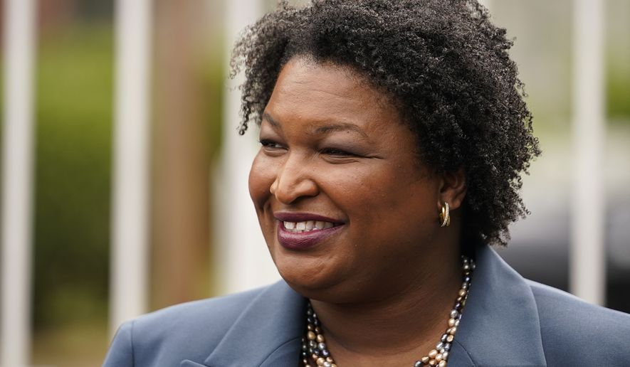 Georgia Democratic gubernatorial candidate Stacey Abrams talks to the media during Georgia&#x27;s primary election on Tuesday, May 24, 2022, in Atlanta. The Georgia governor&#x27;s race is a rematch of 2018, when Brian Kemp narrowly defeated Stacey Abrams. (AP Photo/Brynn Anderson) **FILE**