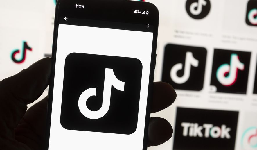The TikTok logo is seen on a cell phone, Friday, Oct. 14, 2022, in Boston. TikTok is giving creators more options on who can see their content with the introduction of an ‘adults-only’ feature for live streaming. (AP Photo/Michael Dwyer)