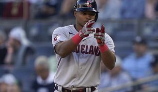 Cleveland Guardians Oscar Gonzalez reacts after hitting an RBI single against the New York Yankees during the tenth inning of Game 2 of an American League Division baseball series, Friday, Oct. 14, 2022, in New York. (AP Photo/John Minchillo)