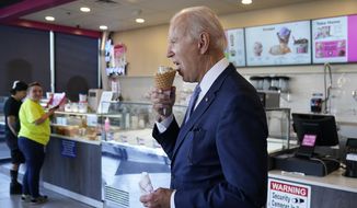 President Joe Biden eats an ice cream cone at a Baskin-Robbins in Portland, Ore., Saturday, Oct. 15, 2022. (AP Photo/Carolyn Kaster)