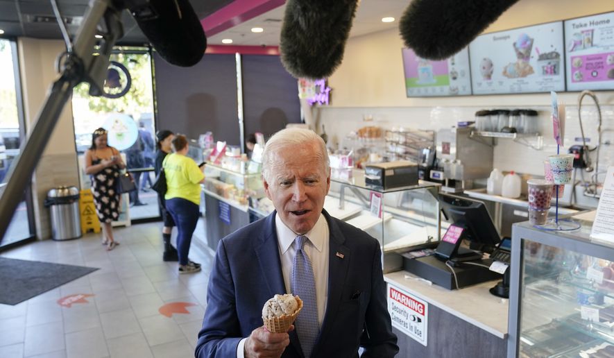 President Joe Biden speaks to members of the media as he visits a Baskin-Robbins in Portland, Ore., Saturday, Oct. 15, 2022. (AP Photo/Carolyn Kaster)