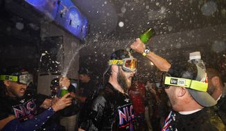 Philadelphia Phillies Bryce Harper, center, is doused after Game 4 of baseball&#x27;s National League Division Series between the Philadelphia Phillies and the Atlanta Braves, Saturday, Oct. 15, 2022, in Philadelphia. The Philadelphia Phillies won, 8-3. (AP Photo/Matt Slocum) **FILE**