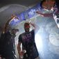 Philadelphia Phillies designated hitter Bryce Harper is doused after a win over the Atlanta Braves in Game 4 of baseball&#x27;s National League Division Series, Saturday, Oct. 15, 2022, in Philadelphia. The Philadelphia Phillies won, 8-3. (AP Photo/Matt Slocum)