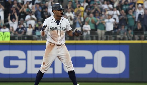 Seattle Mariners&#39;s Julio Rodriguez reacts after stealing second base during the 13th inning in Game 3 of an American League Division Series baseball game against the Houston Astros, Saturday, Oct. 15, 2022, in Seattle. (AP Photo/Ted S. Warren) **FILE**