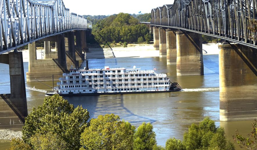 Low-water restrictions on the barge loads make for cautious navigation through the Mississippi River as evidenced by the American Heritage paddlewheeler passing between the river bridges in Vicksburg, Tuesday, Oct. 11, 2022. The unusually low water level in the lower Mississippi River has caused some barges to get stuck in the muddy river bottom, resulting in delays. (AP Photo/Rogelio V. Solis) **FILE**
