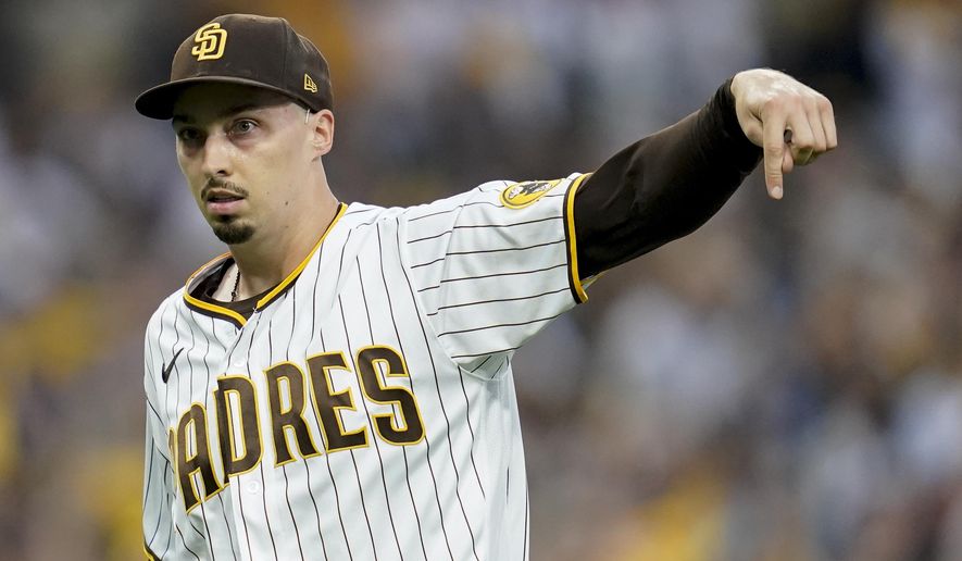 San Diego Padres starting pitcher Blake Snell reacts after striking out Los Angeles Dodgers&#x27; Will Smith during the first inning in Game 3 of a baseball NL Division Series, Friday, Oct. 14, 2022, in San Diego. (AP Photo/Ashley Landis)