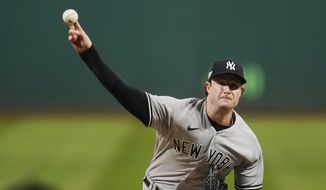 New York Yankees&#39; Gerrit Cole pitches in the first inning of Game 4 of a baseball AL Division Series against the Cleveland Guardians, Sunday, Oct. 16, 2022, in Cleveland. (AP Photo/Sue Ogrocki)