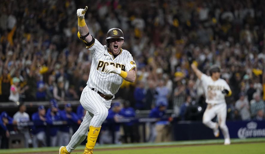 San Diego Padres&#x27; Jake Cronenworth reacts after hitting a two-run single during the seventh inning in Game 4 of a baseball NL Division Series against the Los Angeles Dodgers, Saturday, Oct. 15, 2022, in San Diego. (AP Photo/Ashley Landis) **FILE**
