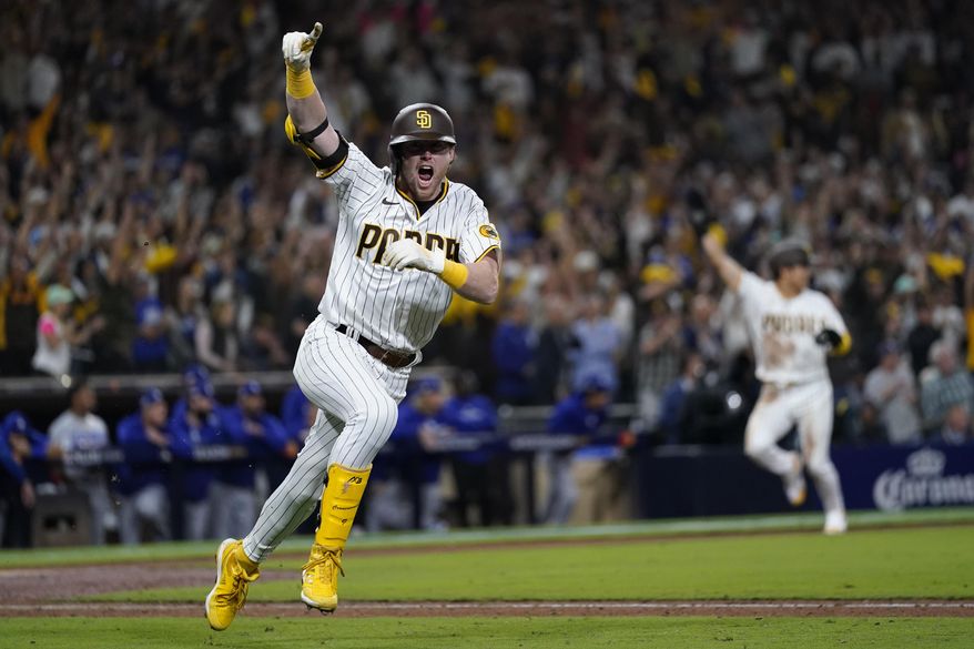San Diego Padres&#x27; Jake Cronenworth reacts after hitting a two-run single during the seventh inning in Game 4 of a baseball NL Division Series against the Los Angeles Dodgers, Saturday, Oct. 15, 2022, in San Diego. (AP Photo/Ashley Landis) **FILE**