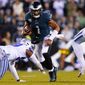 Philadelphia Eagles&#x27; Jalen Hurts runs with the ball during the second half of an NFL football game against the Dallas Cowboys on Sunday, Oct. 16, 2022, in Philadelphia. (AP Photo/Matt Rourke)