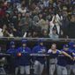 Members of the Los Angeles Dodgers look on from the dugout during the ninth inning in Game 4 of a baseball NL Division Series against the San Diego Padres, Saturday, Oct. 15, 2022, in San Diego. (AP Photo/Ashley Landis) **FILE**