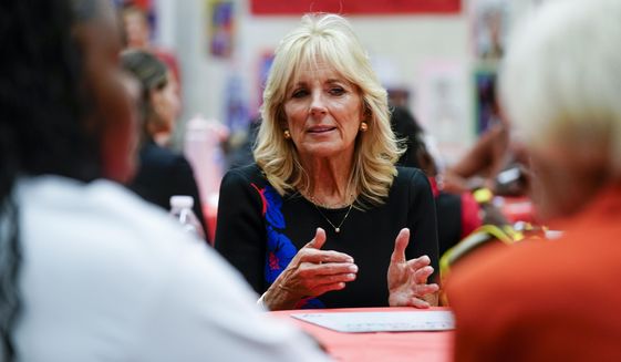 First lady Jill Biden talks to students during a stop at Westside Academy Wednesday, Oct. 12, 2022, in Milwaukee. (AP Photo/Morry Gash)