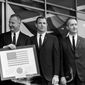 Vice President Spiro Agnew holds a framed American flag, presented to him by the crew of Apollo 9, as he poses with the astronauts March 26, 1969, in Washington. From left: Russell Schweikart, Agnew, and Air Force Cols. David Scott and James McDivitt. McDivitt, who commanded the Apollo 9 mission testing the first complete set of equipment to go to the moon, died Thursday, Oct. 13, 2022. He was 93. (AP Photo/Harvey Georges, File)