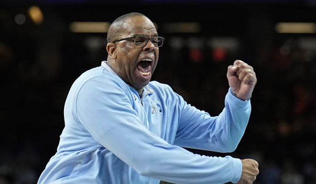 North Carolina head coach Hubert Davis reacts during the second half of a college basketball game against Kansas in the finals of the Men&#x27;s Final Four NCAA tournament, Monday, April 4, 2022, in New Orleans. With four starters back from the team that blew a 15-point halftime lead to Kansas at the Superdome in New Orleans, the Tar Heels were the runaway pick as the preseason No. 1 in the AP Top 25 on Monday, Oct. 17, 2022. (AP Photo/Brynn Anderson, File) **FILE**