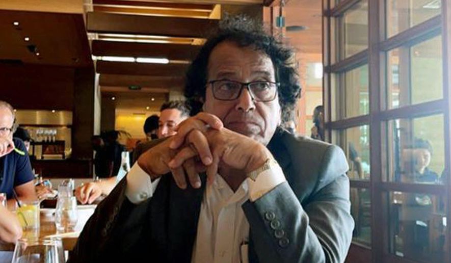 In this photo provided by Ibrahim Almadi, Saad Ibrahim Almadi sits in a restaurant in an unidentified place, in the United States, on August 2021. Almadi, 72, who is a citizen of both Saudi Arabia and the U.S., was arrested in Saudi Arabia last November and was recently sentenced to 16 years in prison over tweets critical of the Saudi government. (Ibrahim Almadi via AP) ** FILE **