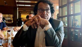 In this photo provided by Ibrahim Almadi, Saad Ibrahim Almadi sits in a restaurant in an unidentified place, in the United States, on August 2021. Almadi, 72, who is a citizen of both Saudi Arabia and the U.S., was arrested in Saudi Arabia last November and was recently sentenced to 16 years in prison over tweets critical of the Saudi government. (Ibrahim Almadi via AP)