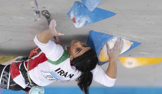 Iranian athlete Elnaz Rekabi competes during the women&#39;s Boulder &amp;amp; Lead final during the IFSC Climbing Asian Championships in Seoul, Sunday, Oct. 16, 2022. Rekabi left South Korea on Tuesday, Oct. 18, 2022 after competing at an event in which she climbed without her nation&#39;s mandatory headscarf covering, authorities said. Farsi-language media outside of Iran warned she may have been forced to leave early by Iranian officials and could face arrest back home, which Tehran quickly denied. (Rhea Khang/International Federation of Sport Climbing via AP)