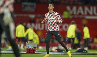 Manchester United&#39;s Cristiano Ronaldo warms up ahead of the English Premier League soccer match between Manchester United and Tottenham Hotspur at Old Trafford in Manchester, England, Wednesday, Oct. 19, 2022. (AP Photo/Dave Thompson)