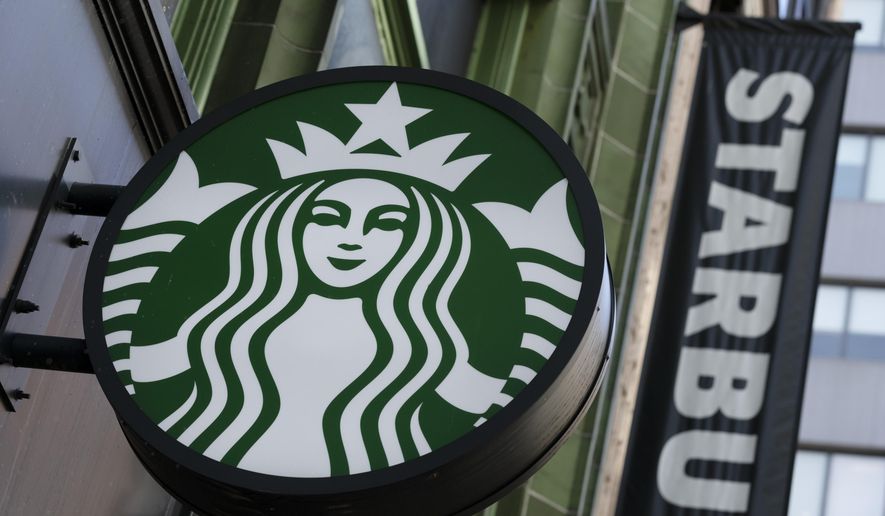 The Starbucks logo is seen on a storefront on Oct. 14, 2022, in Boston. With U.S. union ranks swelling as everyone from coffee shop baristas to warehouse workers seeks to organize, Illinois voters will decide in November 2022 whether to amend their state constitution to guarantee the right to bargain collectively. (AP Photo/Michael Dwyer, File)