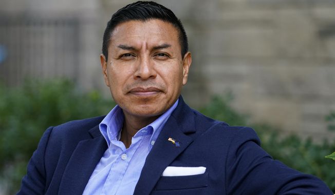 Republican candidate for Indiana Secretary of State Diego Morales poses for a photo in Indianapolis, Tuesday, Sept. 20, 2022. (AP Photo/Michael Conroy)