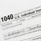 A portion of the 1040 U.S. Individual Income Tax Return form is shown on July 24, 2018, in New York. Taxpayers will get fatter standard deductions for 2023 and all seven federal income tax bracket levels will be revised upward as the government allows people to shield more of their money from taxation because of persistently high inflation. For couples who file jointly for tax year 2023, the standard deduction increases to $27,700 up $1,800 from tax year 2022, the IRS announced. (AP Photo/Mark Lennihan, File)