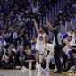 Golden State Warriors guard Stephen Curry (30) watches his 3-pointer against the Los Angeles Lakers during the second half of an NBA basketball game in San Francisco, Tuesday, Oct. 18, 2022. (AP Photo/Godofredo A. Vásquez)