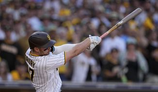 San Diego Padres&#x27; Brandon Drury watches his two-run single during the fifth inning in Game 2 of the baseball NL Championship Series between the San Diego Padres and the Philadelphia Phillies on Wednesday, Oct. 19, 2022, in San Diego. (AP Photo/Brynn Anderson)