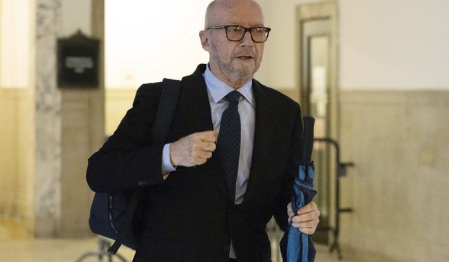 Canadian-born film director Paul Haggis walks inside New York Supreme Court for his sexual assault case, Oct. 17, 2022, in New York. Jurors got their first look Wednesday, Oct. 19, 2022, at a lawsuit that pits Oscar-winning moviemaker Paul Haggis against a publicist who alleges that he raped her, the latest in a lineup of #MeToo-era trials involving Hollywood figures this fall. (AP Photo/Yuki Iwamura, File)
