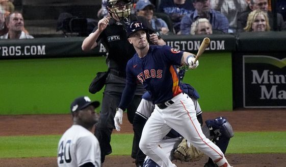 Houston Astros Alex Bregman (2) hits a solo homer during the third inning in Game 2 of baseball&#x27;s American League Championship Series between the Houston Astros and the New York Yankees, Thursday, Oct. 20, 2022, in Houston. (AP Photo/Sue Ogrocki )