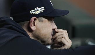 New York Yankees manager Aaron Boone watches play from the dugout during the ninth inning in Game 2 of baseball&#39;s American League Championship Series between the Houston Astros and the New York Yankees, Thursday, Oct. 20, 2022, in Houston. (AP Photo/Kevin M. Cox)
