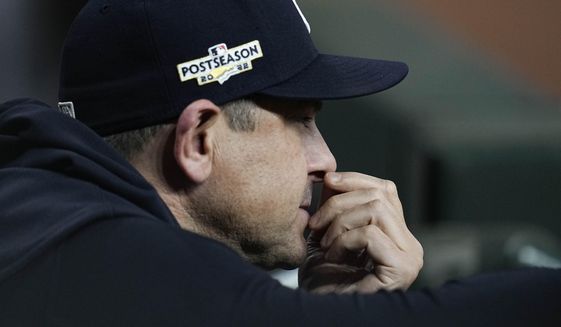 New York Yankees manager Aaron Boone watches play from the dugout during the ninth inning in Game 2 of baseball&#x27;s American League Championship Series between the Houston Astros and the New York Yankees, Thursday, Oct. 20, 2022, in Houston. (AP Photo/Kevin M. Cox)