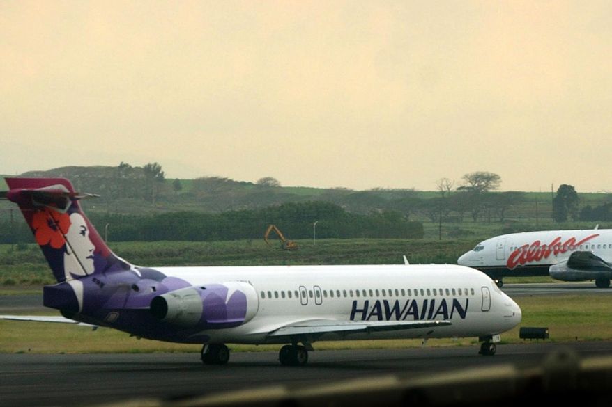 A Hawaiian Airlines plane taxis at Kahalui, Hawaii on the island of Maui on March 24, 2005. Hawaiian Airlines will operate 10 cargo planes for Amazon.com starting next fall under a deal that could eventually involve more planes and give Amazon a 15% stake in the airline, the airline’s parent company, Hawaiian Holdings Inc., said Friday, Oct. 21, 2022. (AP Photo/Lucy Pemoni, FIle)
