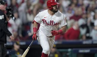 Philadelphia Phillies&#x27; Kyle Schwarber watches his home run during the first inning in Game 3 of the baseball NL Championship Series between the San Diego Padres and the Philadelphia Phillies on Friday, Oct. 21, 2022, in Philadelphia.(AP Photo/Matt Slocum)
