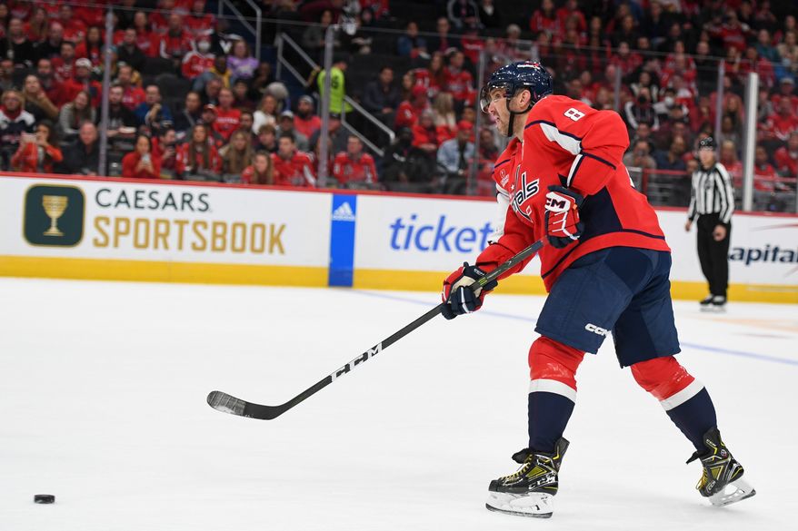Washington Capitals left wing Alex Ovechkin (8) making a pass during the 2nd period in a game against the Los Angeles Kings at Capital One Arena in Washington D.C., October 22, 2022. (Photo by Billy Sabatini)
