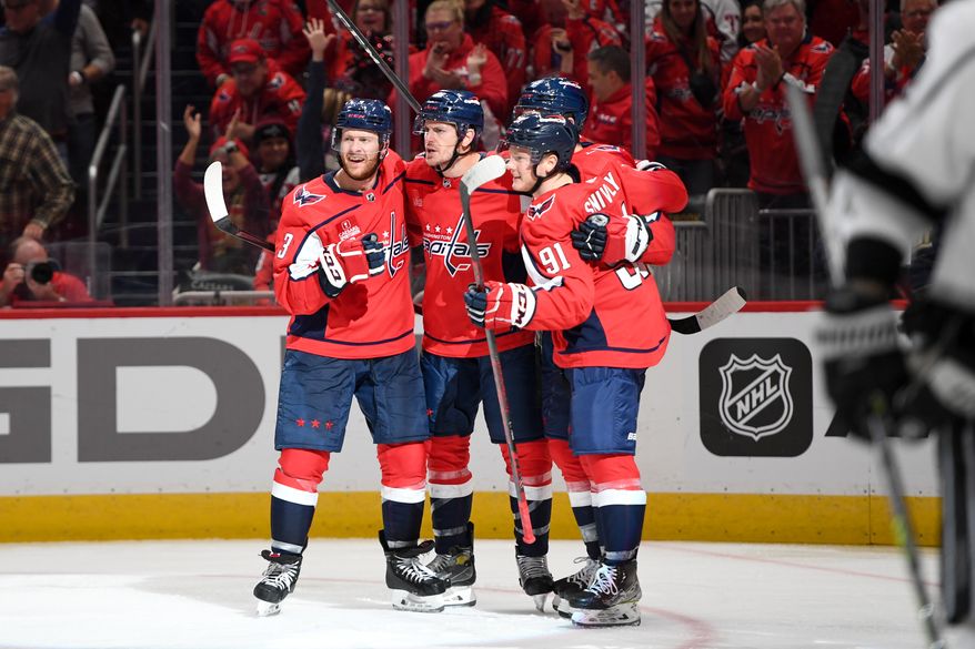Capitals players celebrate center Nic Dowd’s (26) 3rd period goal in a game against the Los Angeles Kings at Capital One Arena in Washington D.C., October 22, 2022. (Photo by Billy Sabatini)